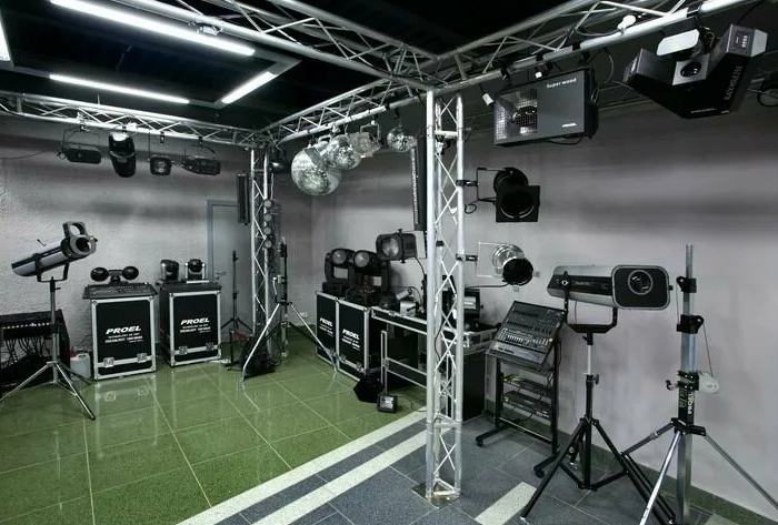 Intelligent lighting fixtures rigged above a dockside stage