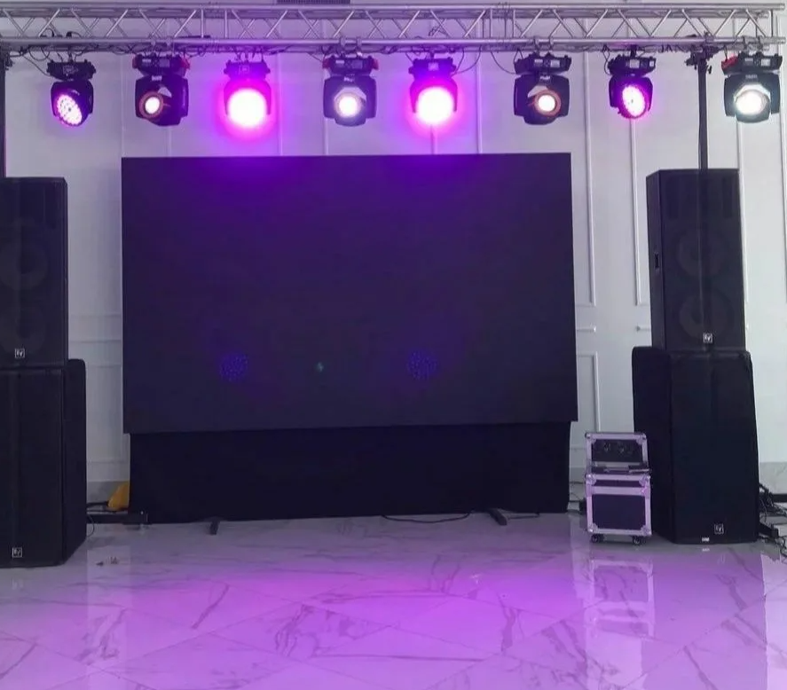 Crew installing modular stage and lighting equipment at a port